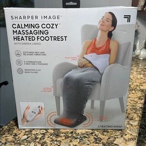 Sharper Image Gray Massaging Heated Footrest and plush blanket.